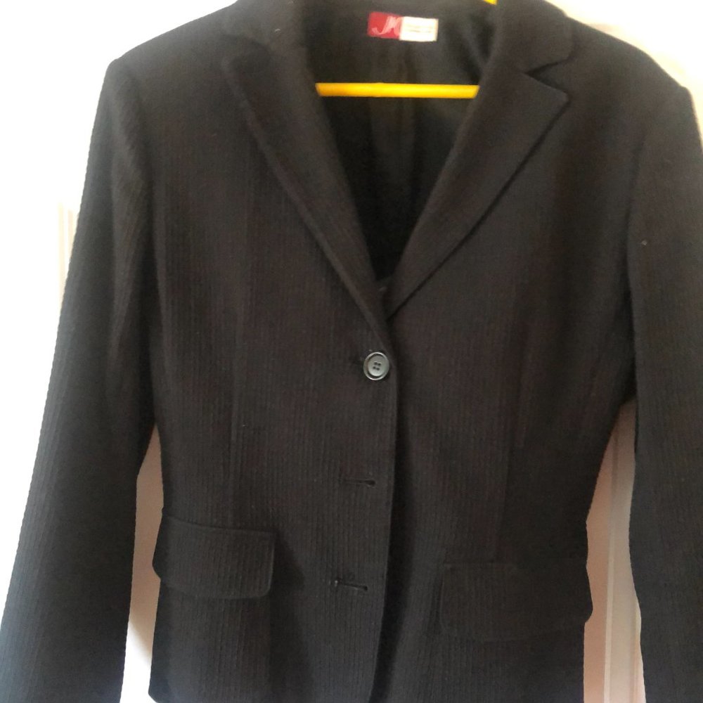 Black cropped fitted jacket...back belt adjusts.